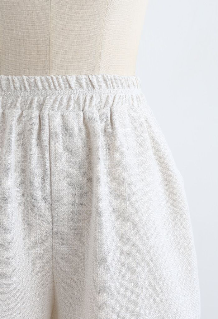 Pantalones cortos de lino y algodón con bolsillos en la cintura elástica en marfil