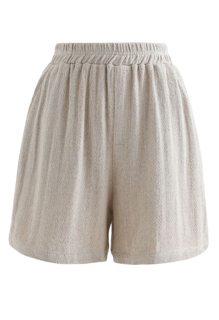 Pantalones cortos de lino y algodón con bolsillos en la cintura elástica en color arena