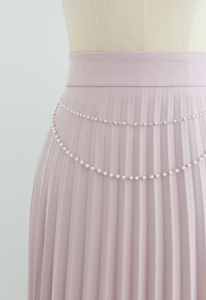 Falda midi plisada con cadena drapeada en rosa