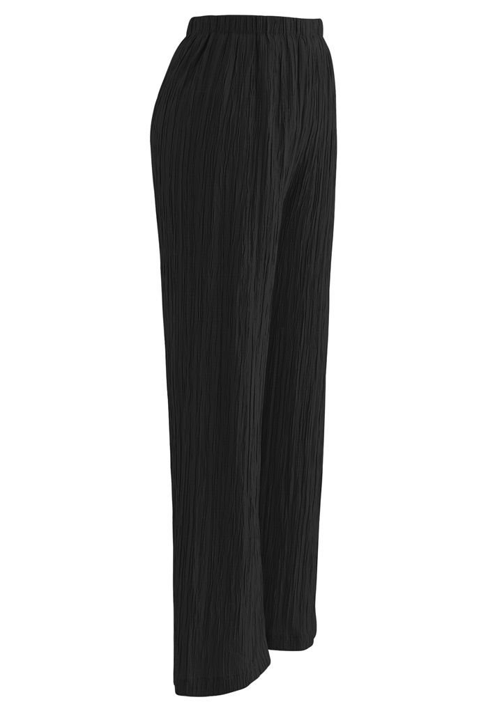Pantalones de tiro alto con pliegues en negro