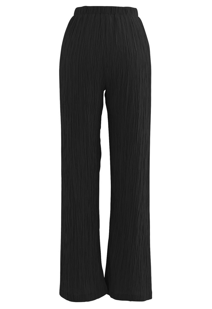 Pantalones de tiro alto con pliegues en negro