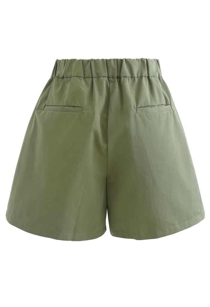 Shorts plisados con bolsillo lateral con cremallera de tiro alto en verde militar
