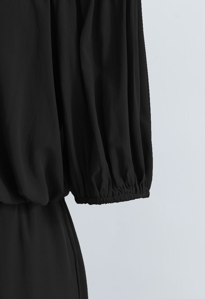 Conjunto de pantalón y top corto con hombros descubiertos en negro