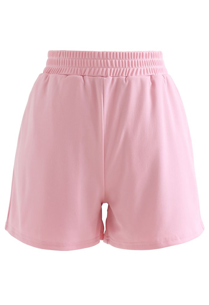Conjunto de top corto con lazo en la espalda y shorts en rosa