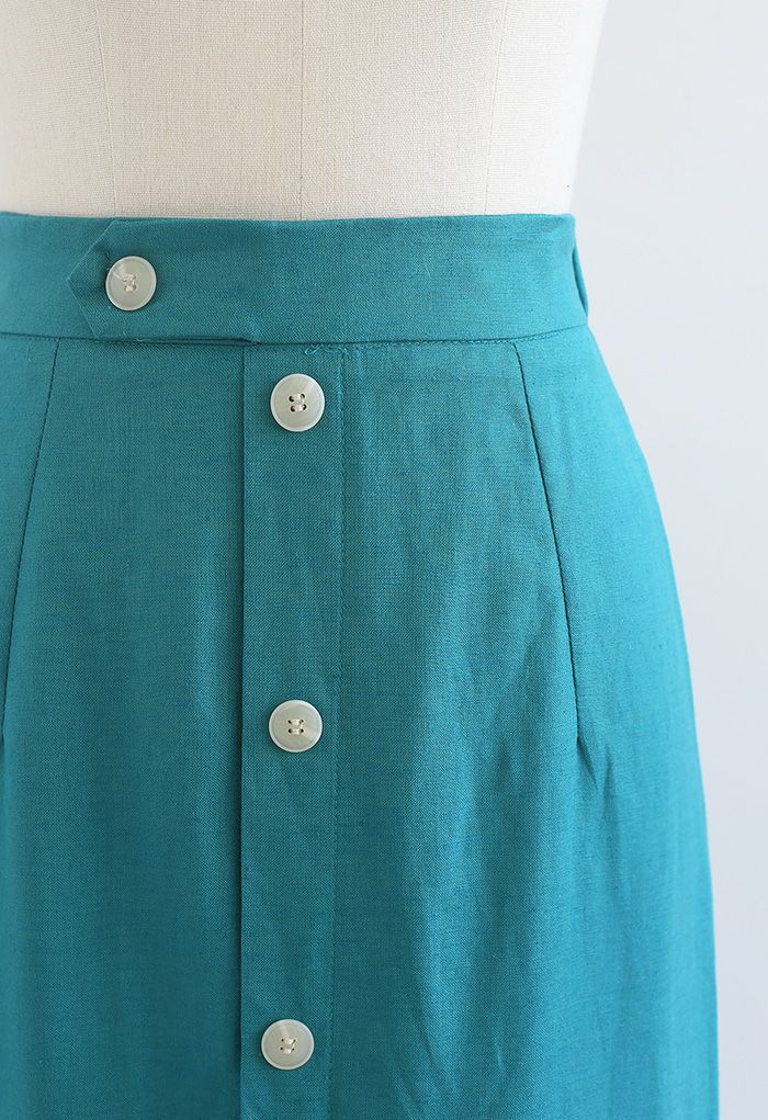 Falda midi adornada con botones y abertura delantera en verde azulado