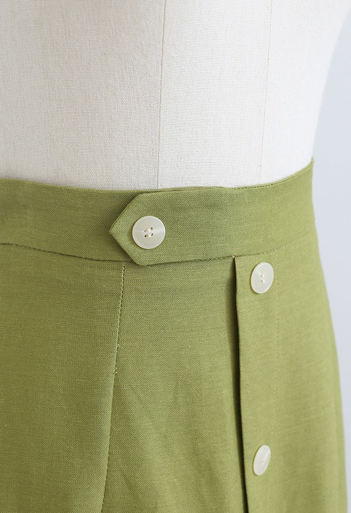 Falda midi adornada con botones y abertura delantera en verde musgo