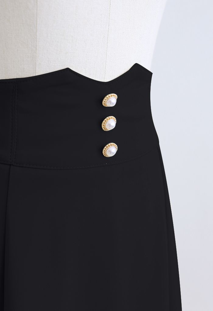 Falda midi acampanada con detalle de costura en la cintura nacarada en negro