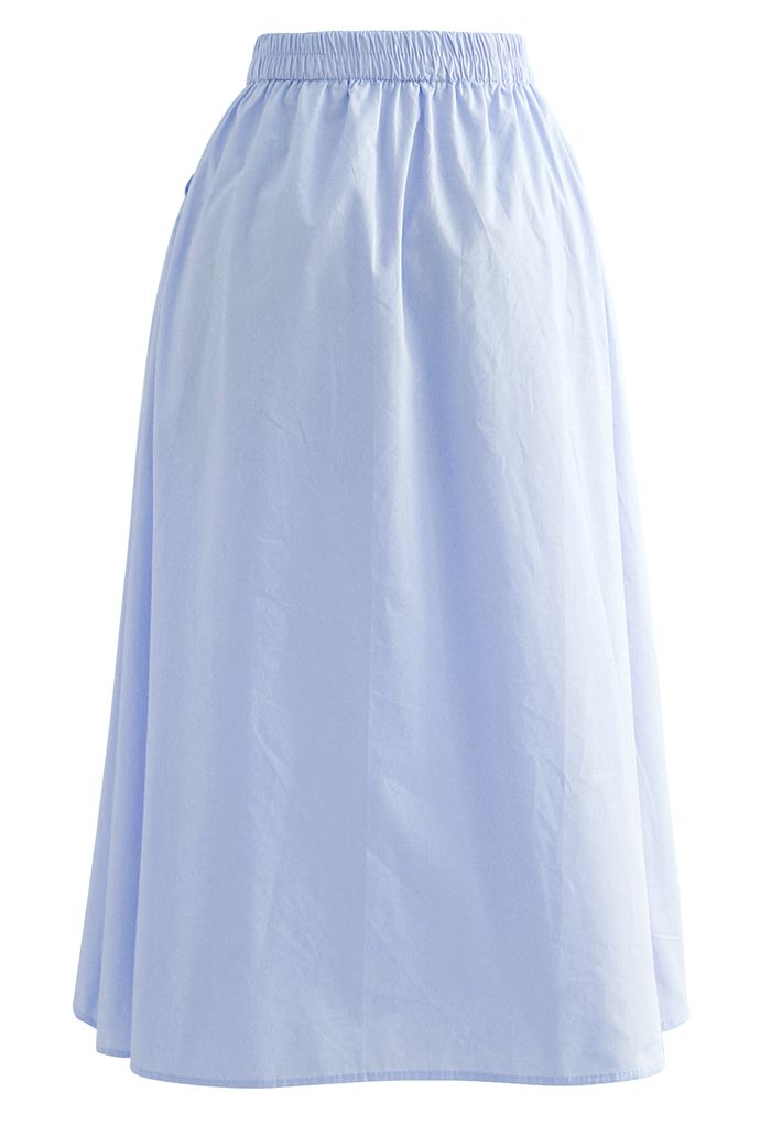 Falda de algodón con bolsillo lateral en color liso en azul