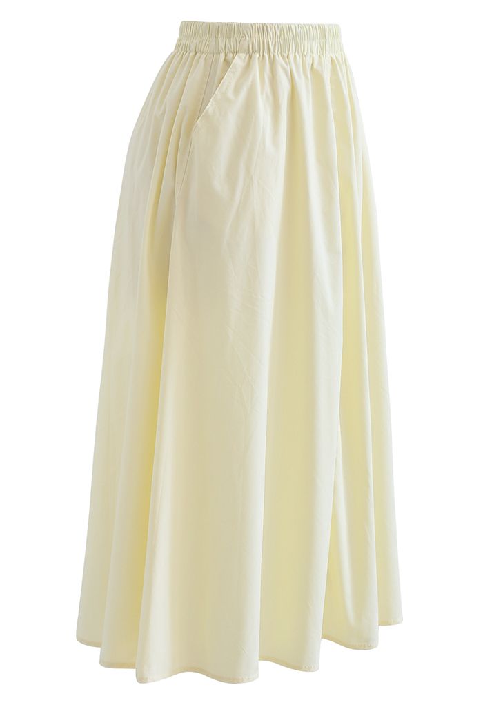 Falda de algodón con bolsillo lateral en color liso en amarillo claro