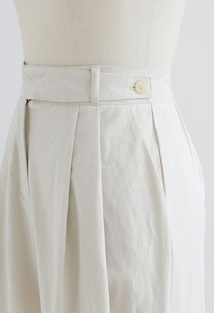 Pantalones de algodón de pierna recta con cinturón en marfil