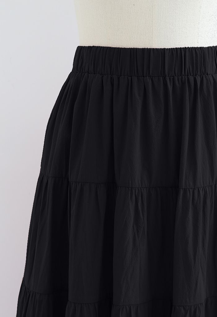 Falda midi de algodón con volantes en color liso en negro