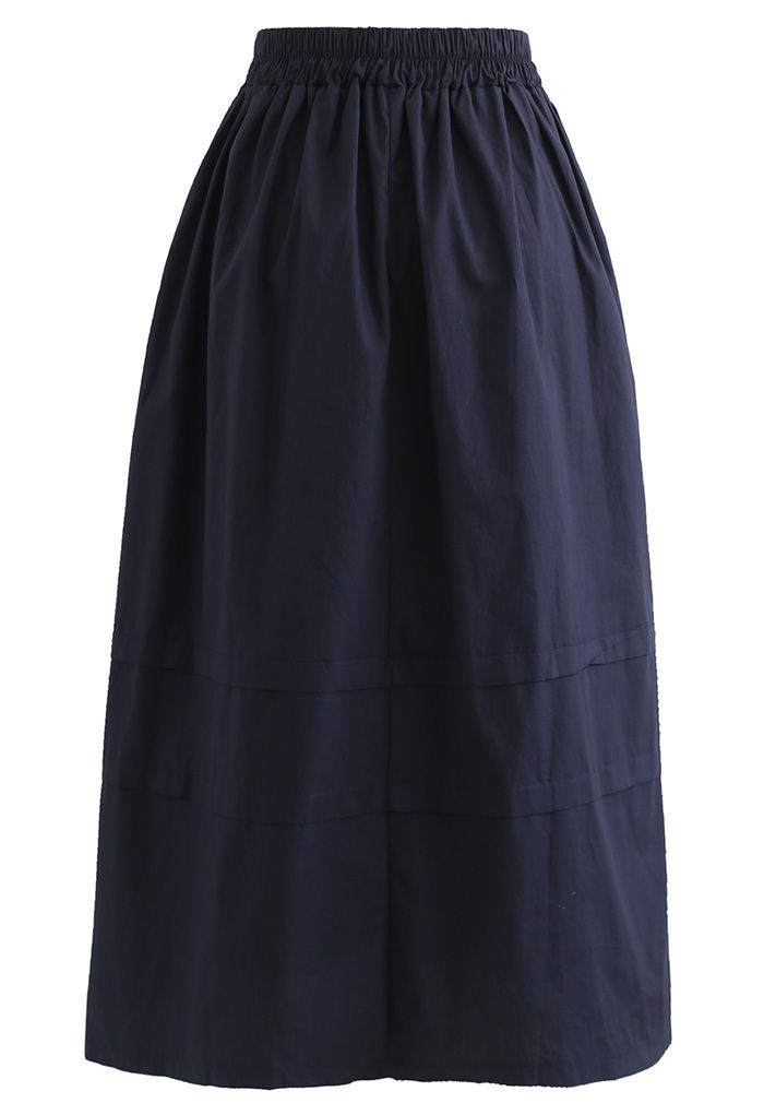 Falda midi decorada con detalle de pliegues en azul marino