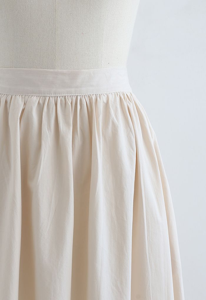 Falda midi versátil de algodón en color crema