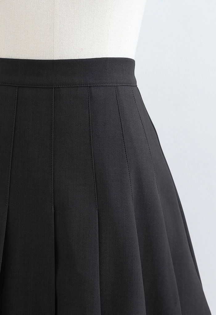 Minifalda plisada de cintura alta en negro