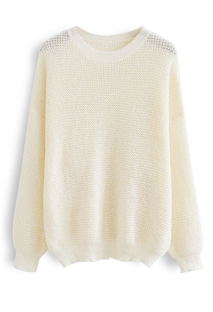 Suéter de punto extragrande con agujeros en color crema