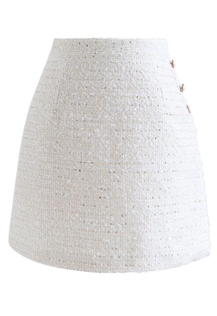 Minifalda de tweed con lentejuelas y ribete de botones en blanco