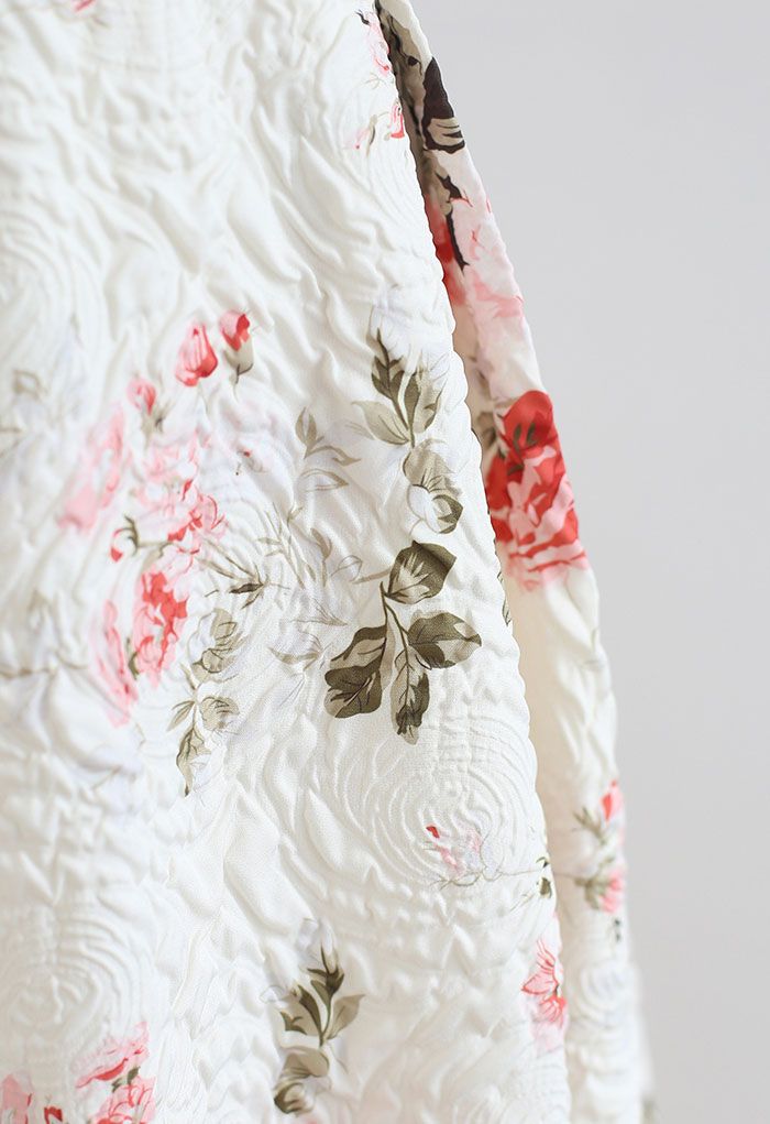 Falda midi plisada floral en relieve en marfil