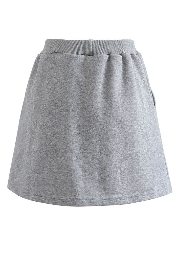 Minifalda pantalón de algodón con bolsillo con cordón en gris