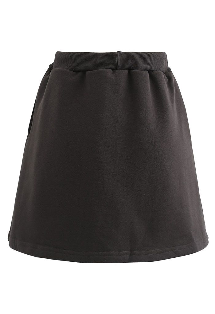 Minifalda pantalón de algodón con bolsillo con cordón en marrón