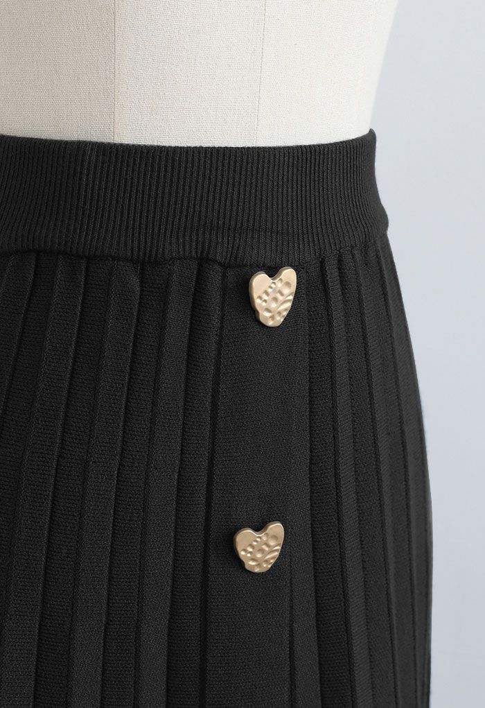 Falda de punto plisada decorada con corazones dorados en negro