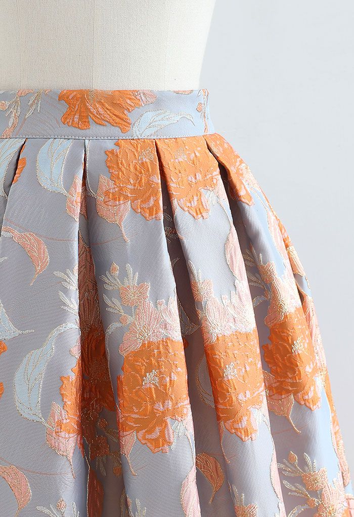 Falda midi plisada de jacquard con ramo naranja