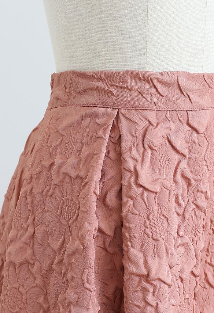 Falda midi plisada con estampado de girasoles en coral