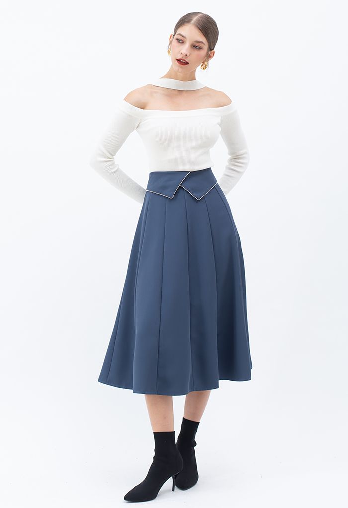 Falda midi con detalle de costuras con solapa de cristal en azul polvoriento