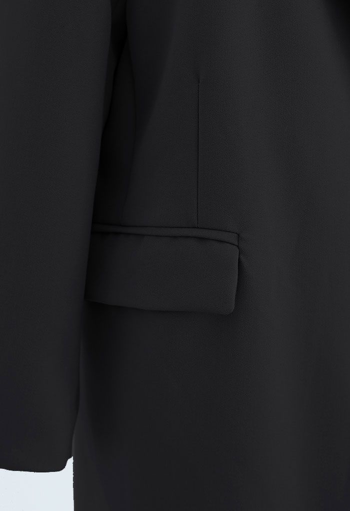 Abrigo largo de abotonadura sencilla con bolsillo en negro