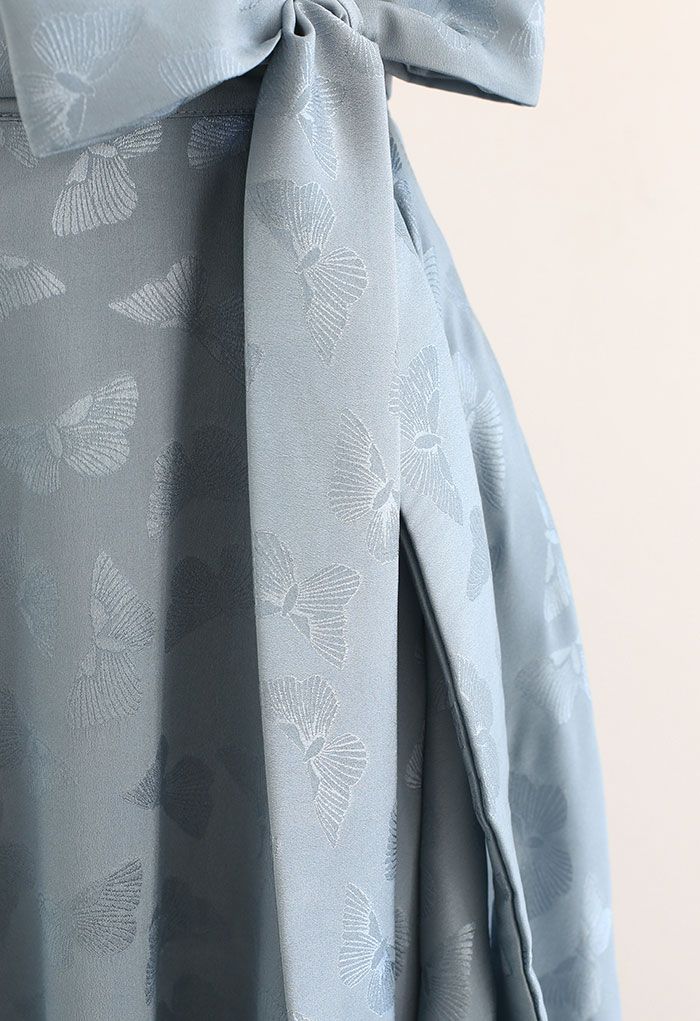 Falda midi acampanada con lazo de mariposa en jacquard en azul polvoriento