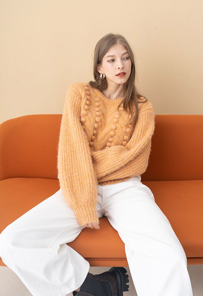Suéter de tejido mixto de canalé con pompones difusos en naranja