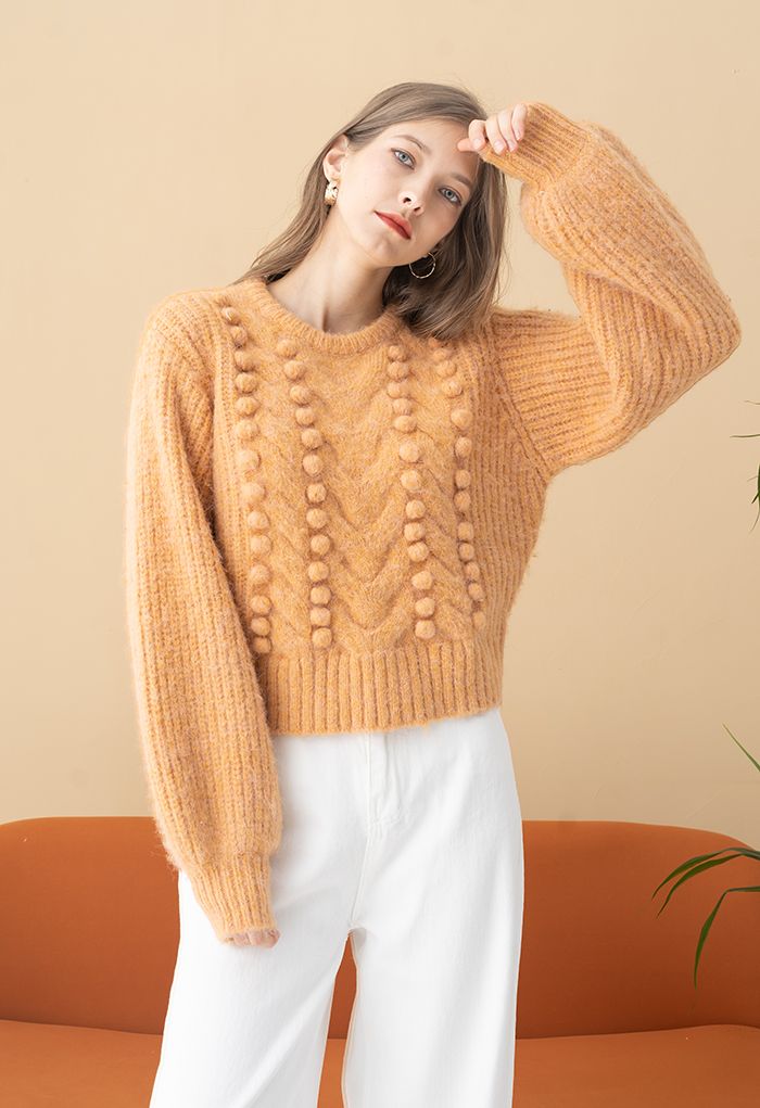 Suéter de tejido mixto de canalé con pompones difusos en naranja