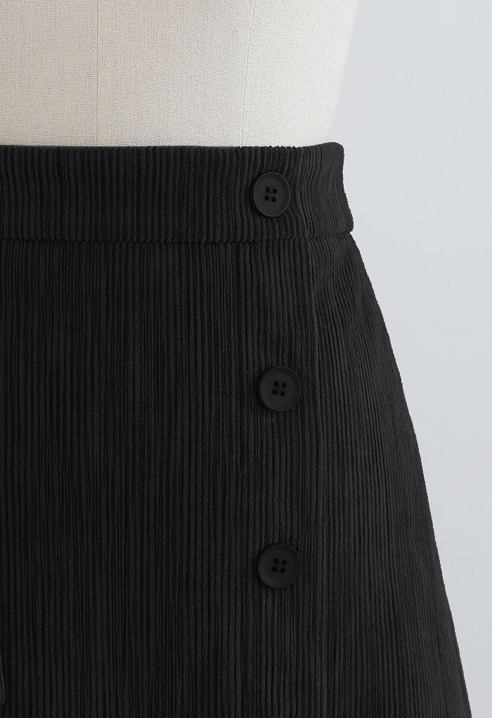 Minifalda Bud de pana negra decorada con botones