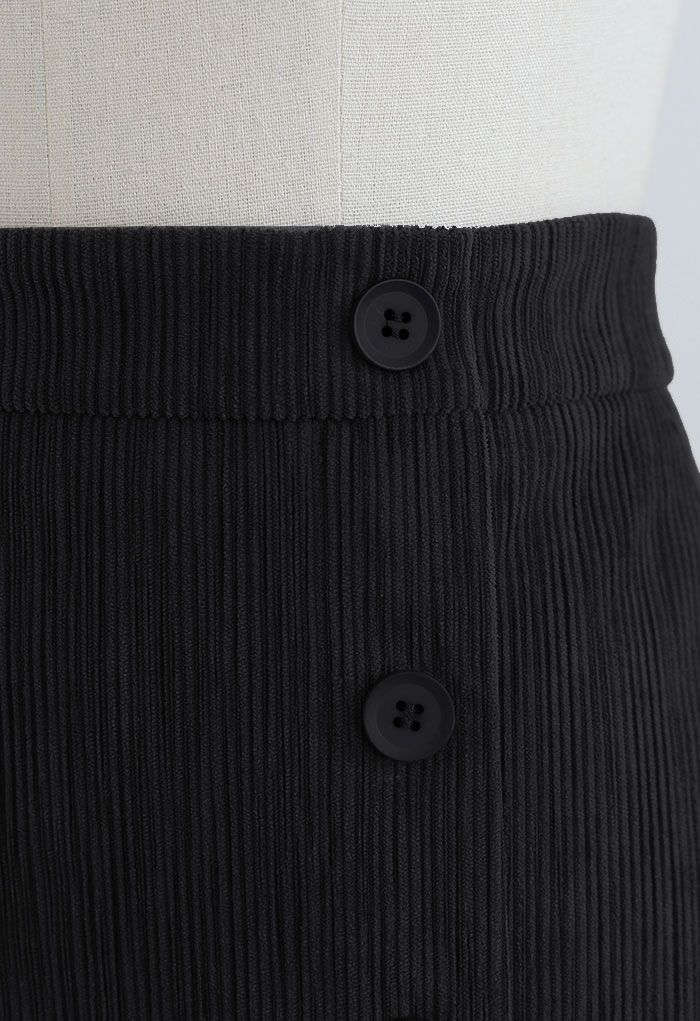 Minifalda Bud de pana negra decorada con botones