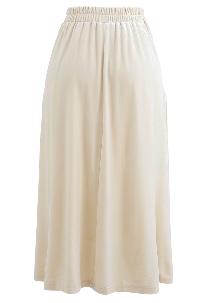 Falda midi plisada de terciopelo con brillo en crema