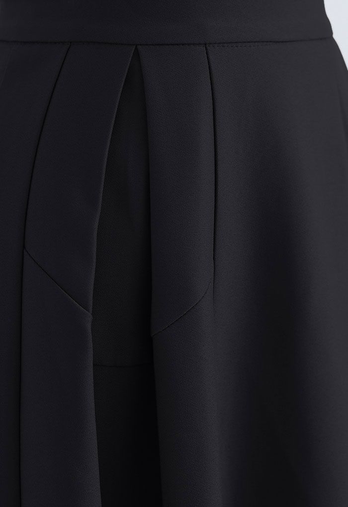 Falda midi plisada de una línea funcional en negro