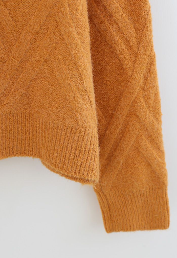 Suéter de punto difuso con patrón entrecruzado en naranja