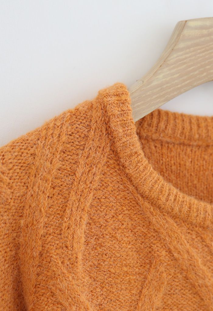 Suéter de punto difuso con patrón entrecruzado en naranja