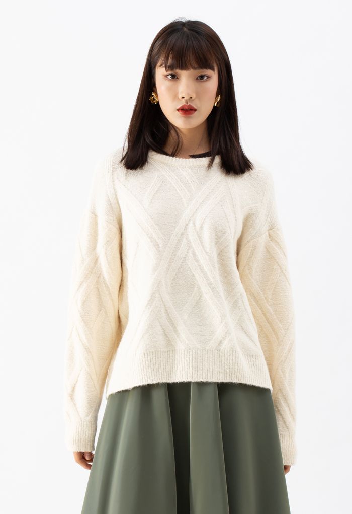 Suéter de punto difuso con patrón entrecruzado en crema