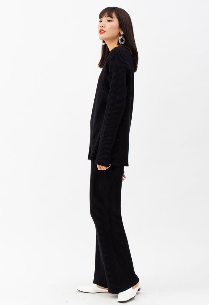Conjunto de suéter y pantalones de punto acanalado con dobladillo dividido en negro