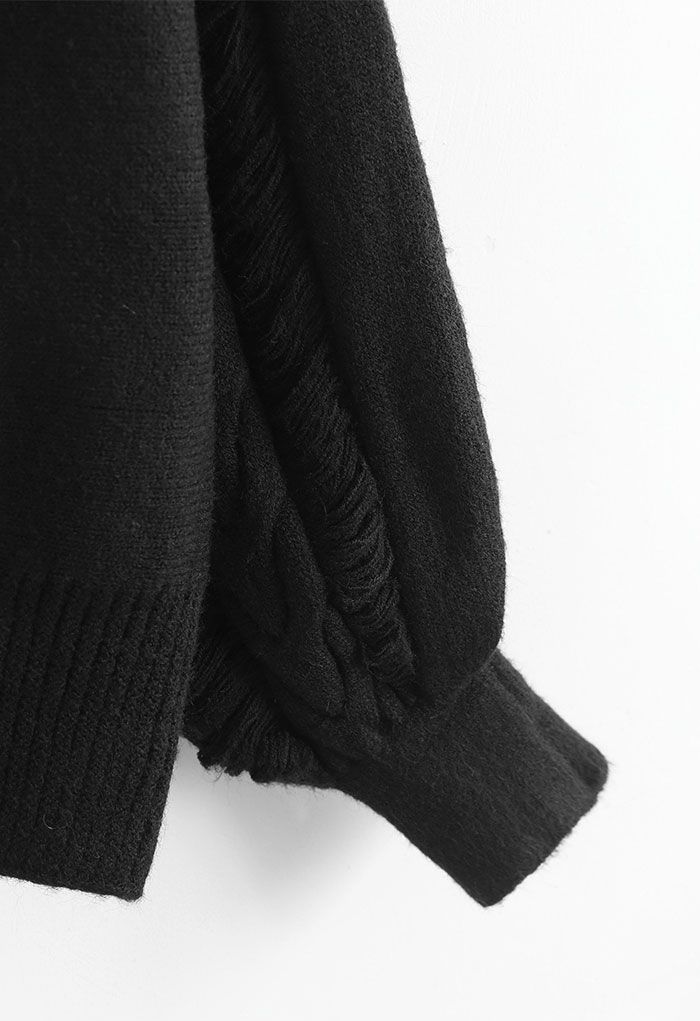 Suéter de punto con cuello alto y detalles de flecos en negro
