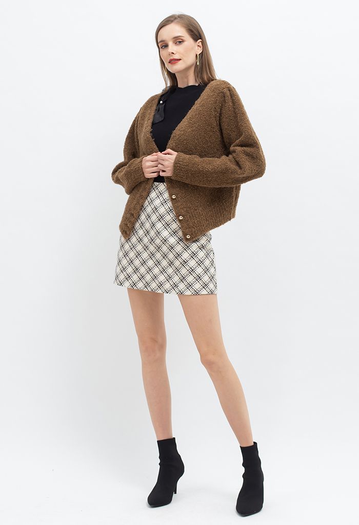Minifalda de tweed con estampado de cuadros escoceses en marfil
