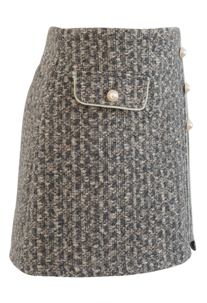 Minifalda de tweed con botones y flecos dorados en humo