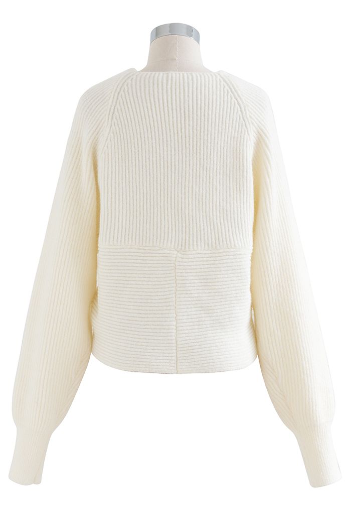 Suéter corto de punto acanalado entrecruzado en marfil