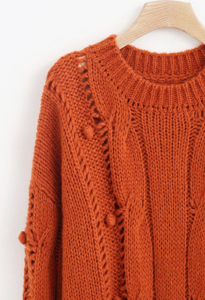 Suéter de punto grueso con ojales Pom-Pom en naranja