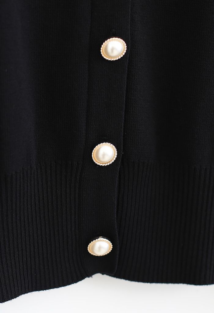 Top de punto con cuello en V y mangas transparentes con botones en negro