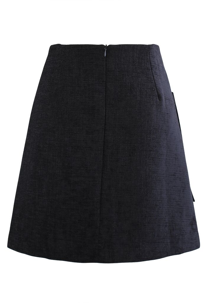 Minifalda de tweed brillante con bolsillo de parche en negro