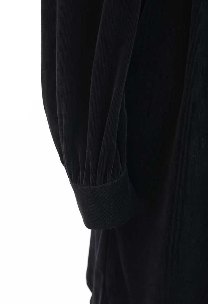 Minivestido cruzado de pana con manga larga en negro
