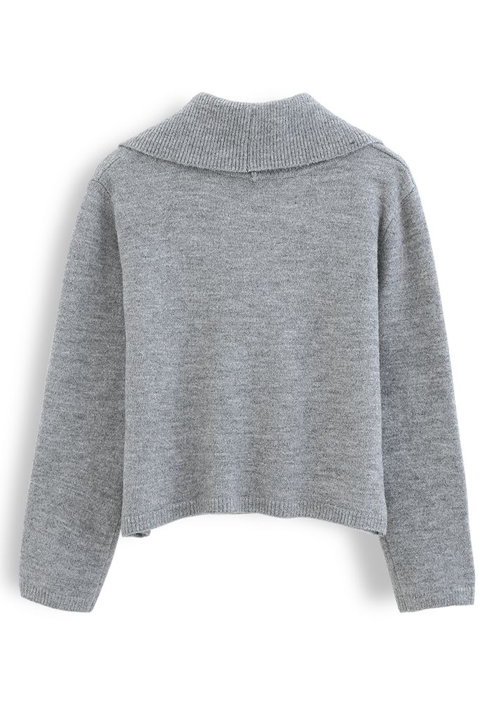 Suéter de punto con hombros descubiertos y cuello en gris
