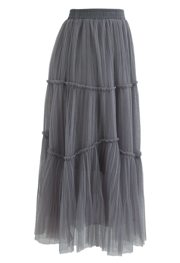 Falda plisada con detalle de volantes de malla suave en gris