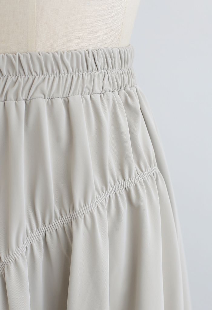 Falda plisada elástica de piel sintética en marfil